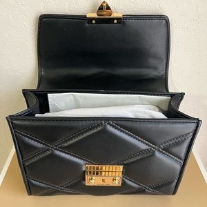 Micheal kors 
Serena Small Quilted Faux Leather Crossbody Bag